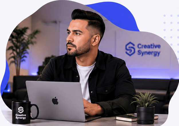 Creative director reviewing strategy at his laptop
